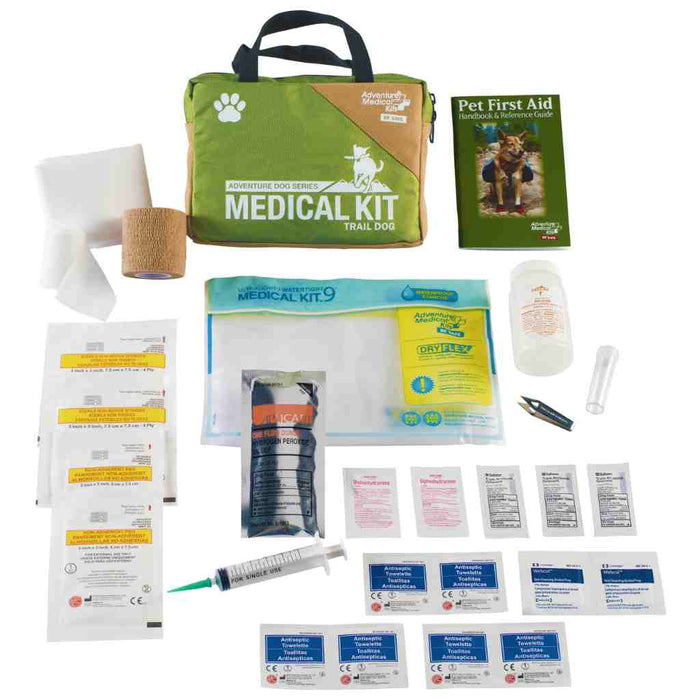 Red waterproof Trail Dog Medical Kit with pet first aid guide and bandages