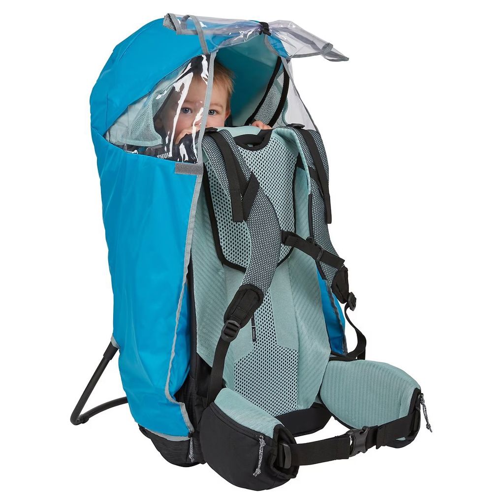 Clear side windows of the Thule rain cover allowing a child to enjoy the view while staying protected from the elements