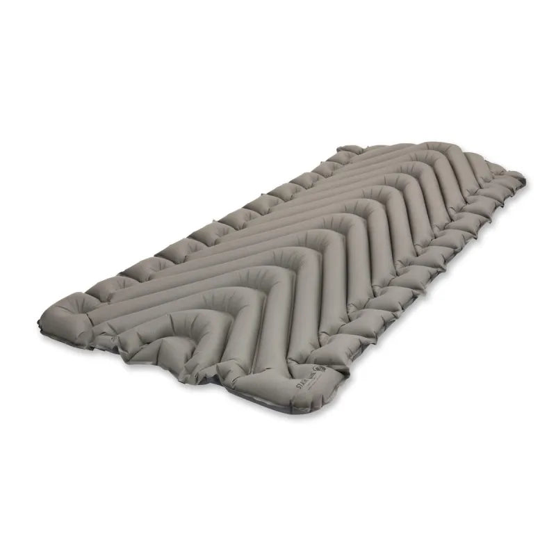 The Static V Luxe sleeping pad packed down to a compact size of 8 x 4.5 inches, roughly the size of a one-liter water bottle, ready for