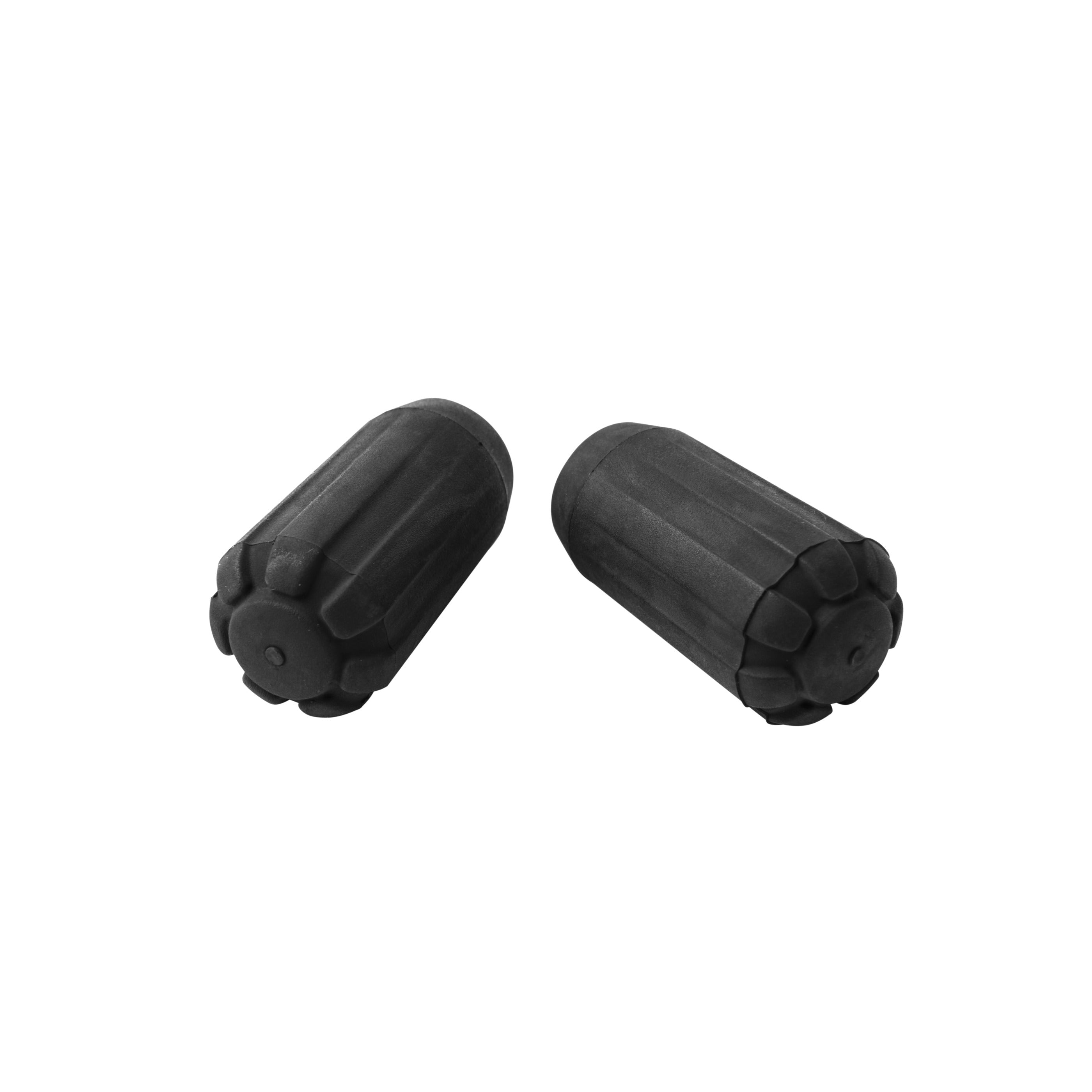 Black rubber trekking pole tip protectors for hiking poles on rocky trail.