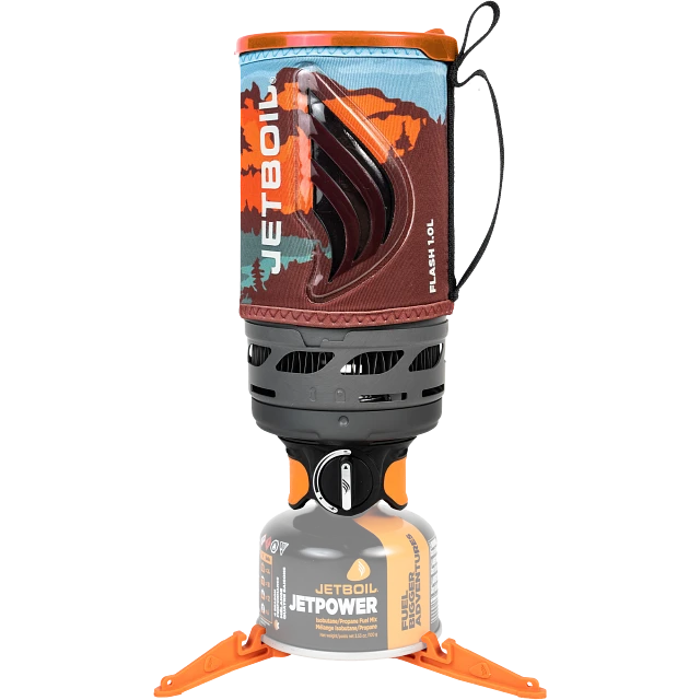 Jetboil Flash 1.0L Fast Boil System in its full setup, featuring a 1L FluxRing cooking cup wrapped in an insulating cozy with a visible Jetboil logo. The system is available in Mountainscape, Ocean Topo, Dark Camo, and Carbon color options.