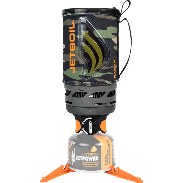 The Jetboil Flash 1.0L neatly packed inside its cooking cup, with the bottom cover serving as a measuring cup and bowl. The burner and fuel canister are compactly stored inside for easy transport.