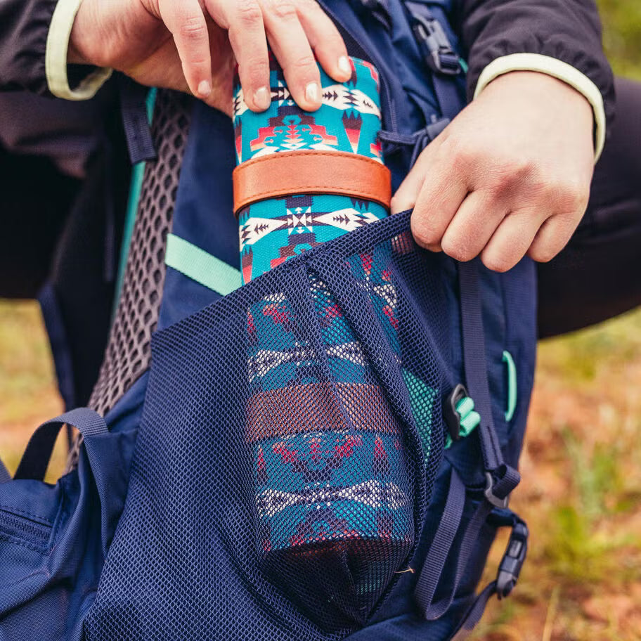 Women’s trekking backpack with hipbelt pockets and body-hugging suspension system