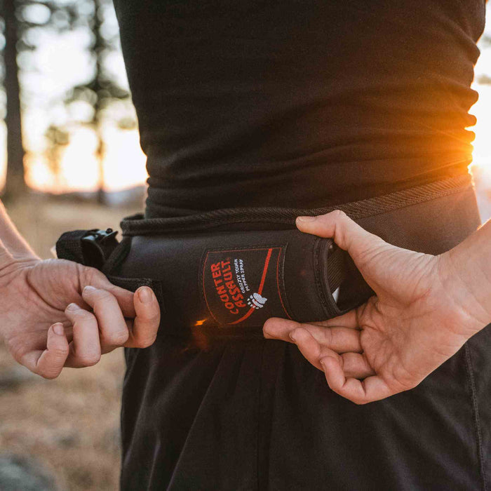 Bear Spray Waist Holster used for a water bottle – Showcasing the holster’s multifunctional use for carrying a water bottle.