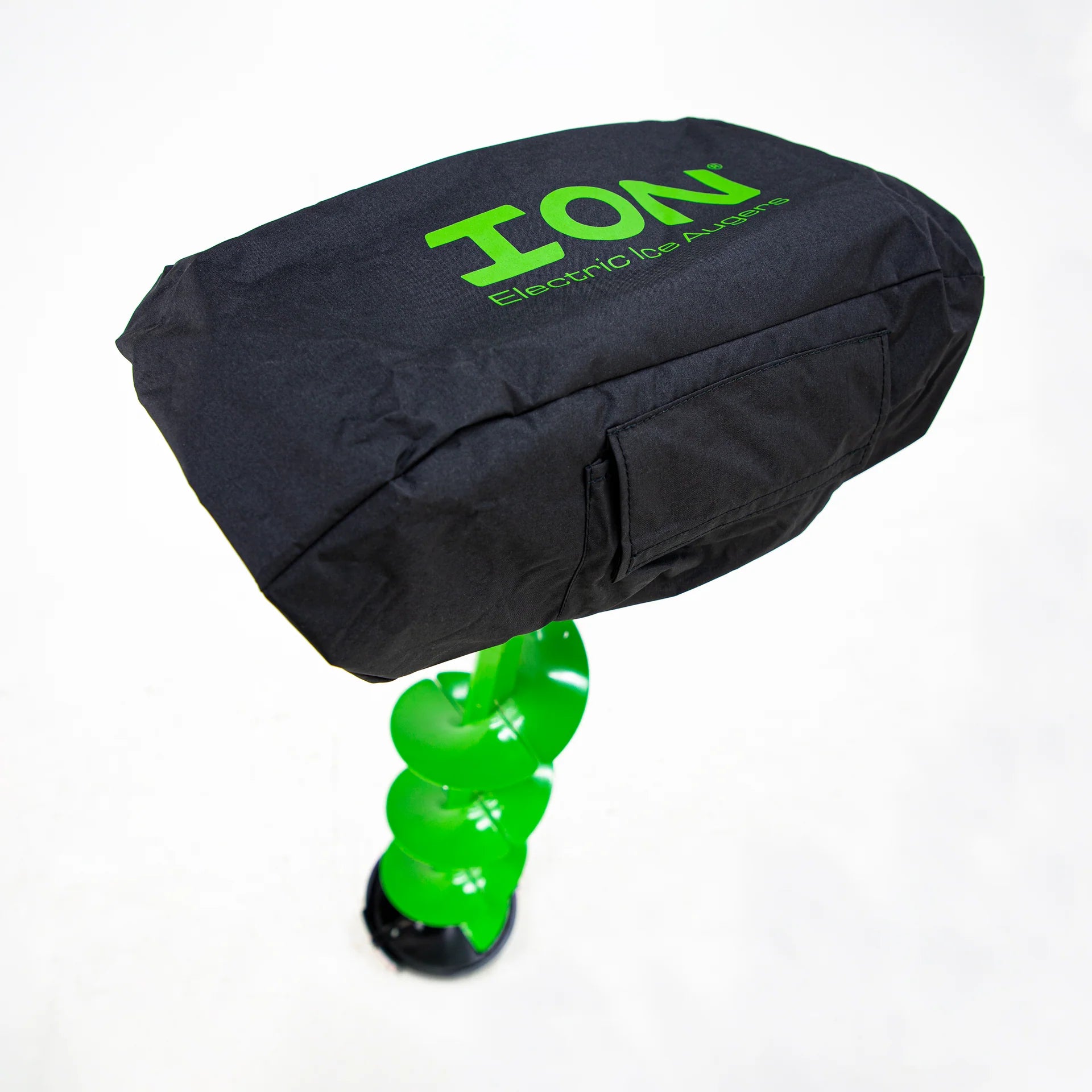 ION® ice auger powerhead covered with a black protective cover, shielding it from winter weather conditions. A side pocket is visible, providing storage for an Allen wrench or small accessories.