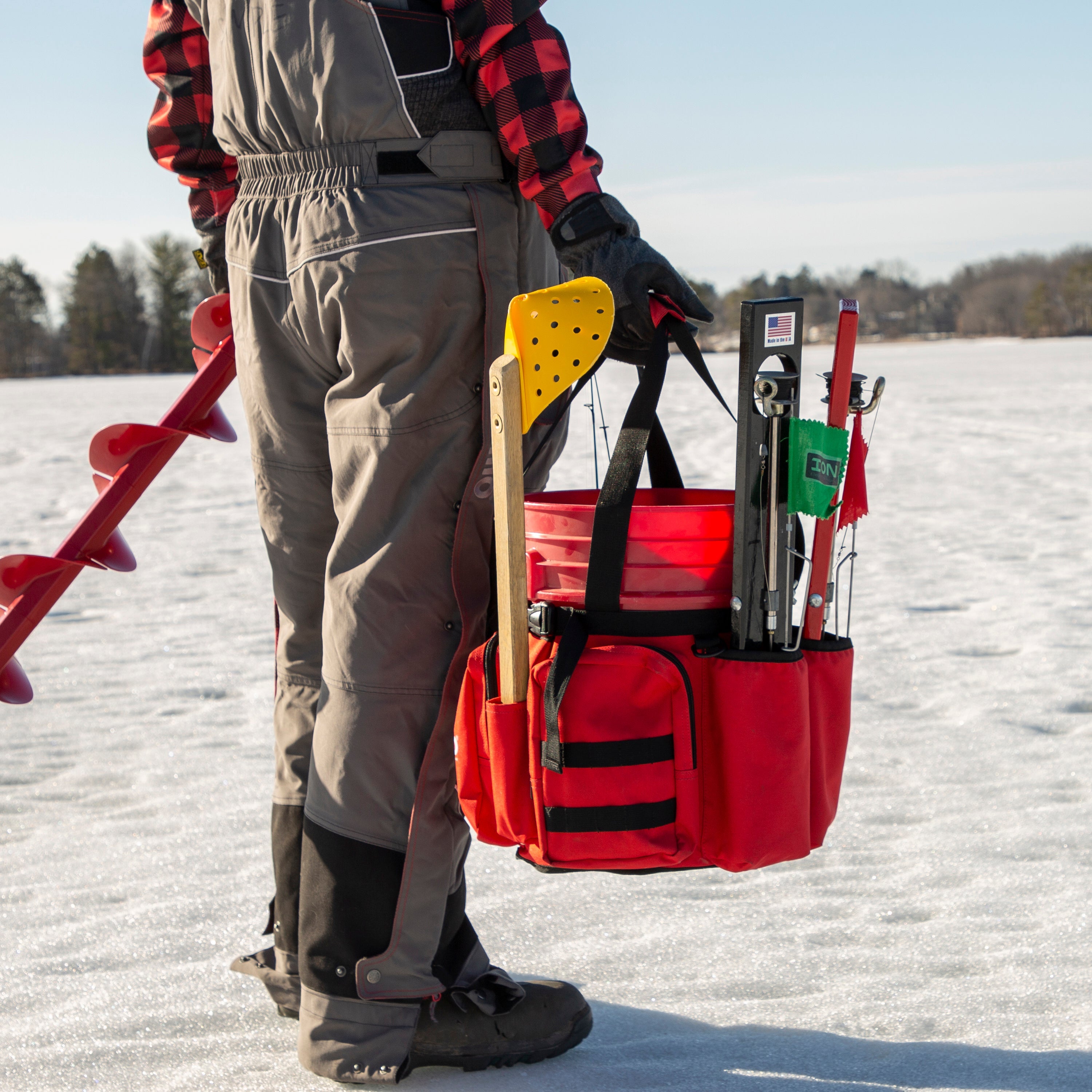 Close-up of two large zippered pockets on the Eskimo Bucket Caddy, designed for storing gear and keeping items secure.