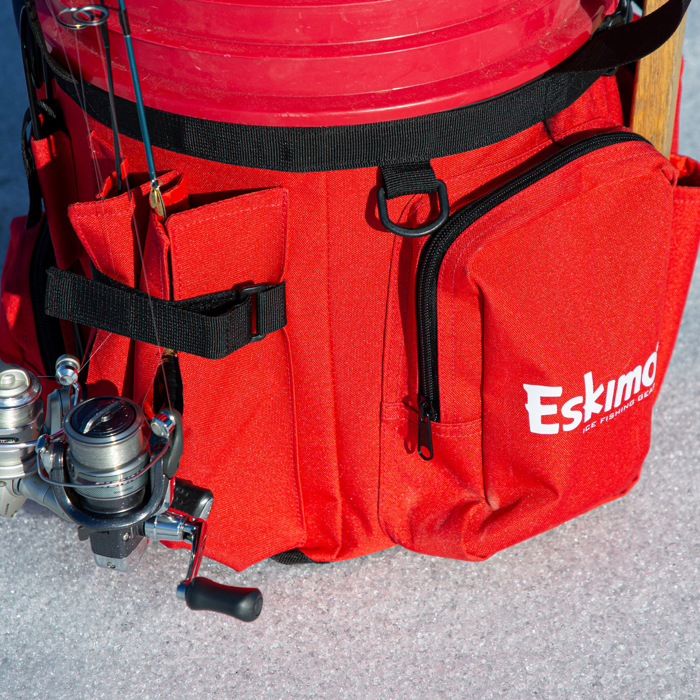 Detailed view of the bait puck pocket on the Eskimo Bucket Caddy, convenient for quick access during ice fishing.