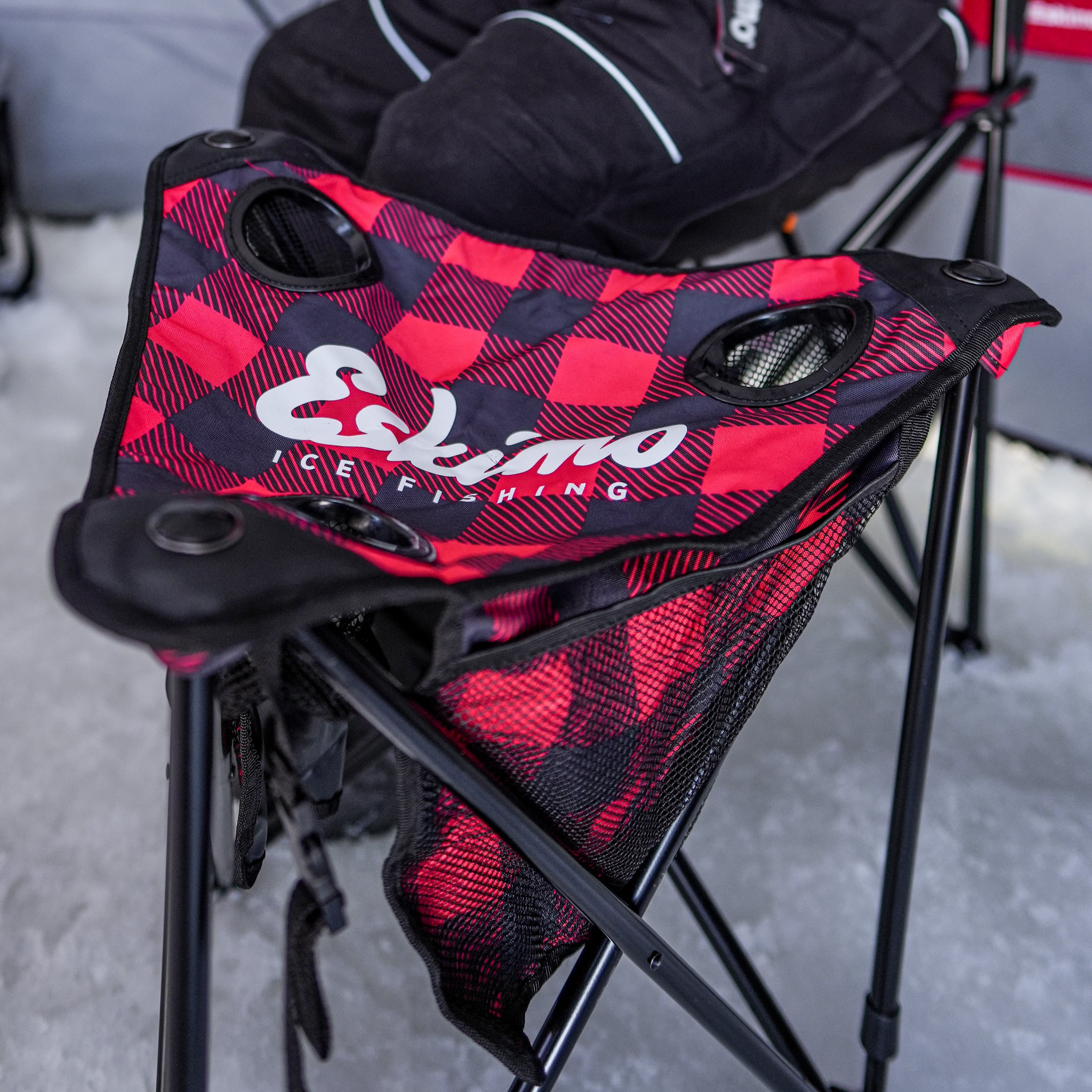 Ice fishing stool with mesh storage pockets