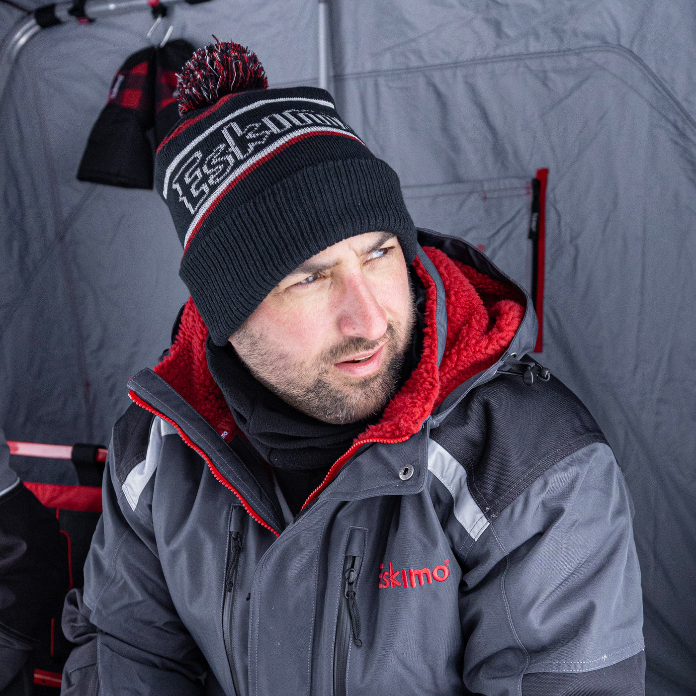 Reflective pom winter hat showing knit texture and pom-pom top