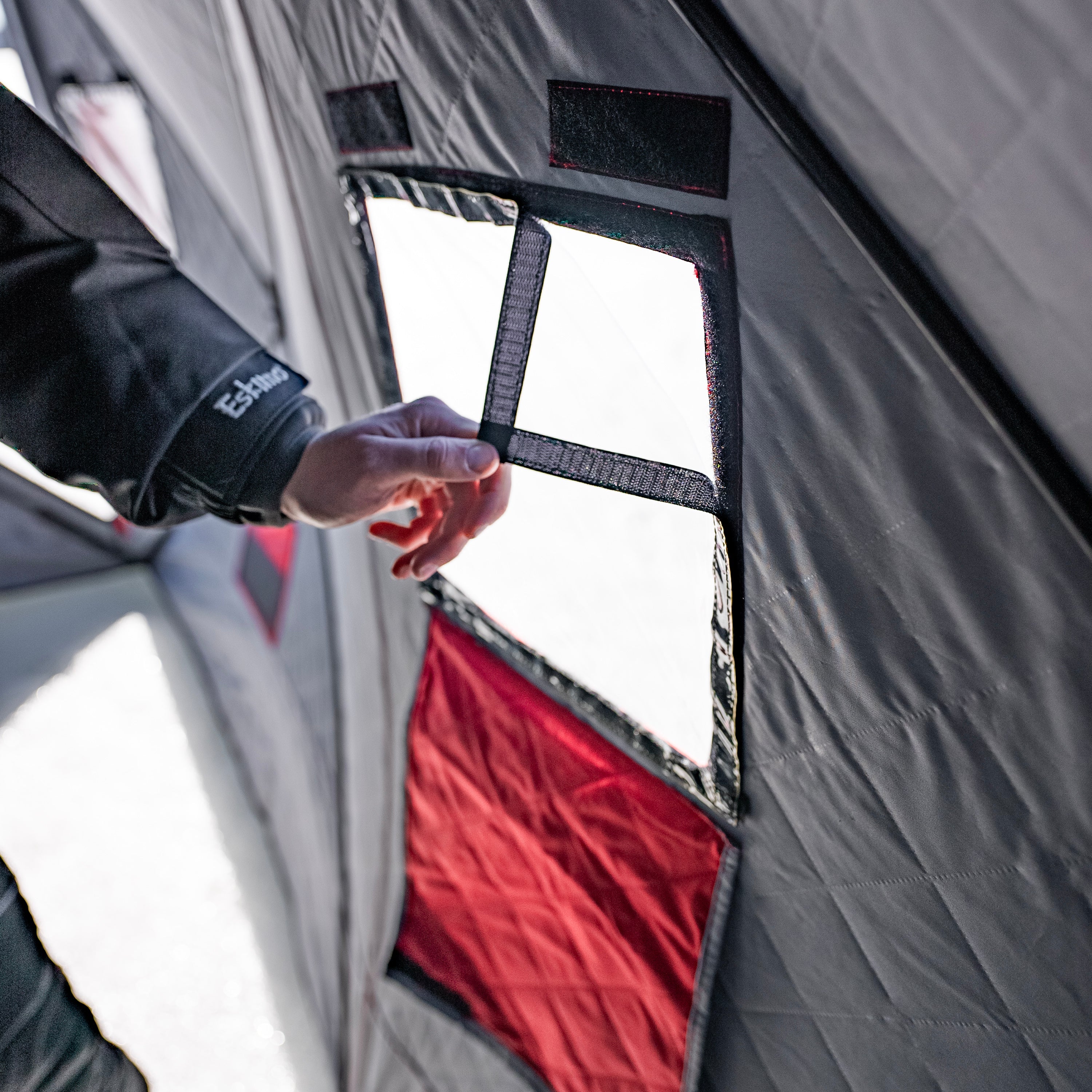 Built-in mesh storage pockets inside the QuickFish HD shelter for storing fishing gear.