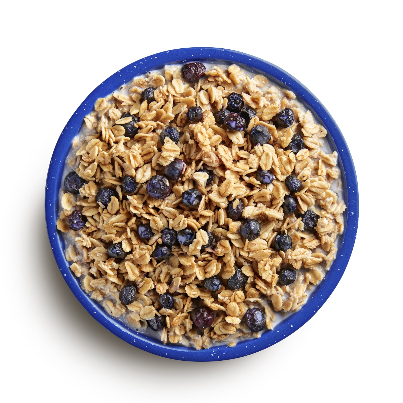 Blue bowl filled with granola and blueberries on a white background