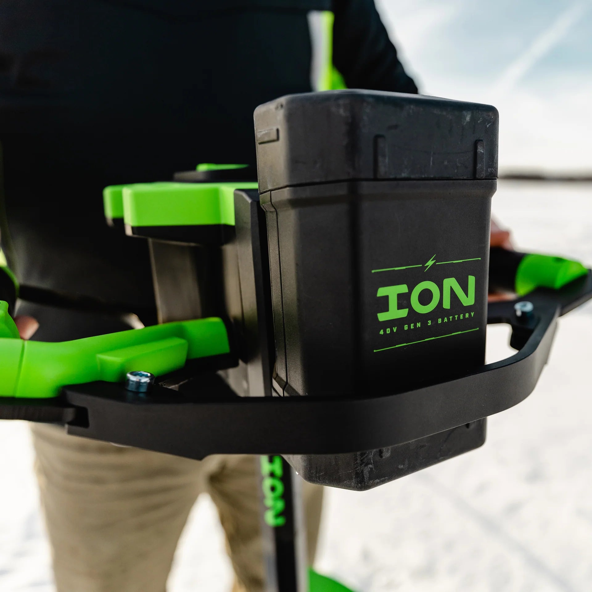 ION Alpha Plus ice auger featuring slush-flushing reverse mode and a variable speed trigger for precise drilling.