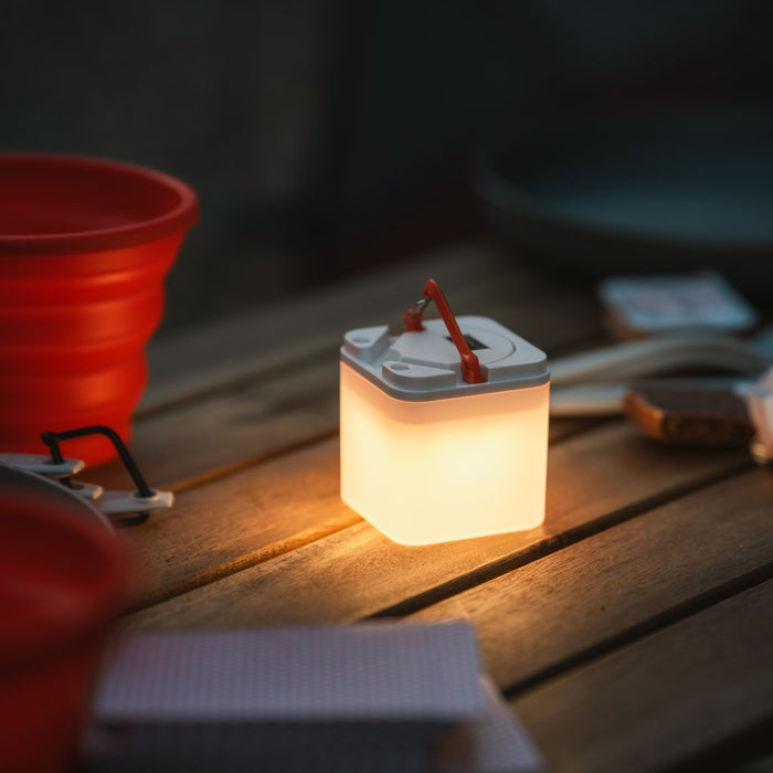LuminAID Trio solar lantern set creating warm ambient lighting