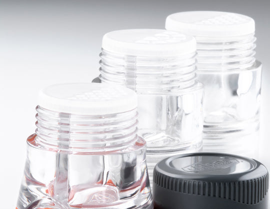 Close-up of dual-chamber modules with screw-on design for independent spice storage.