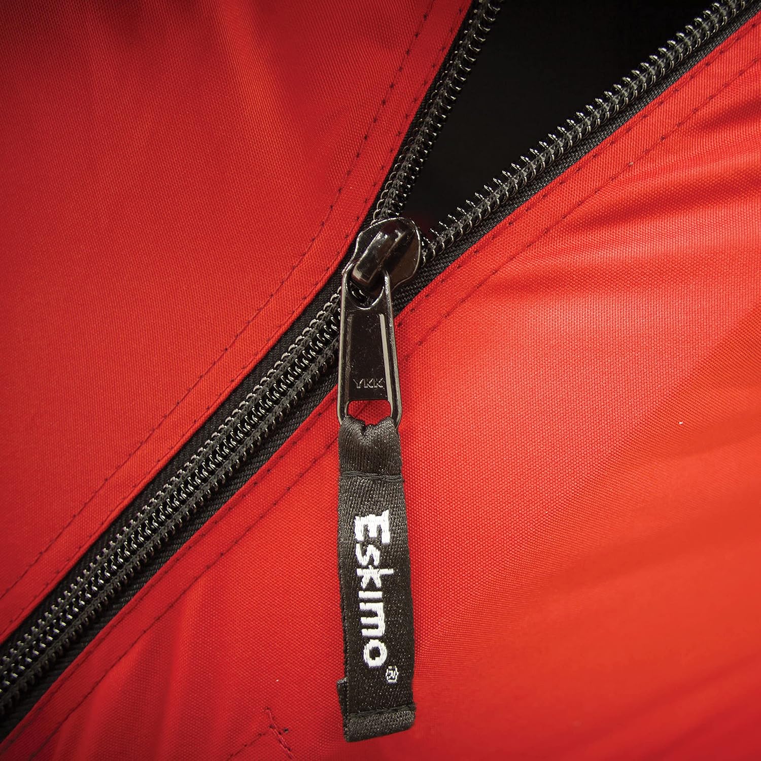 QuickFish 6 portable ice shelter set up beside ice fishing holes