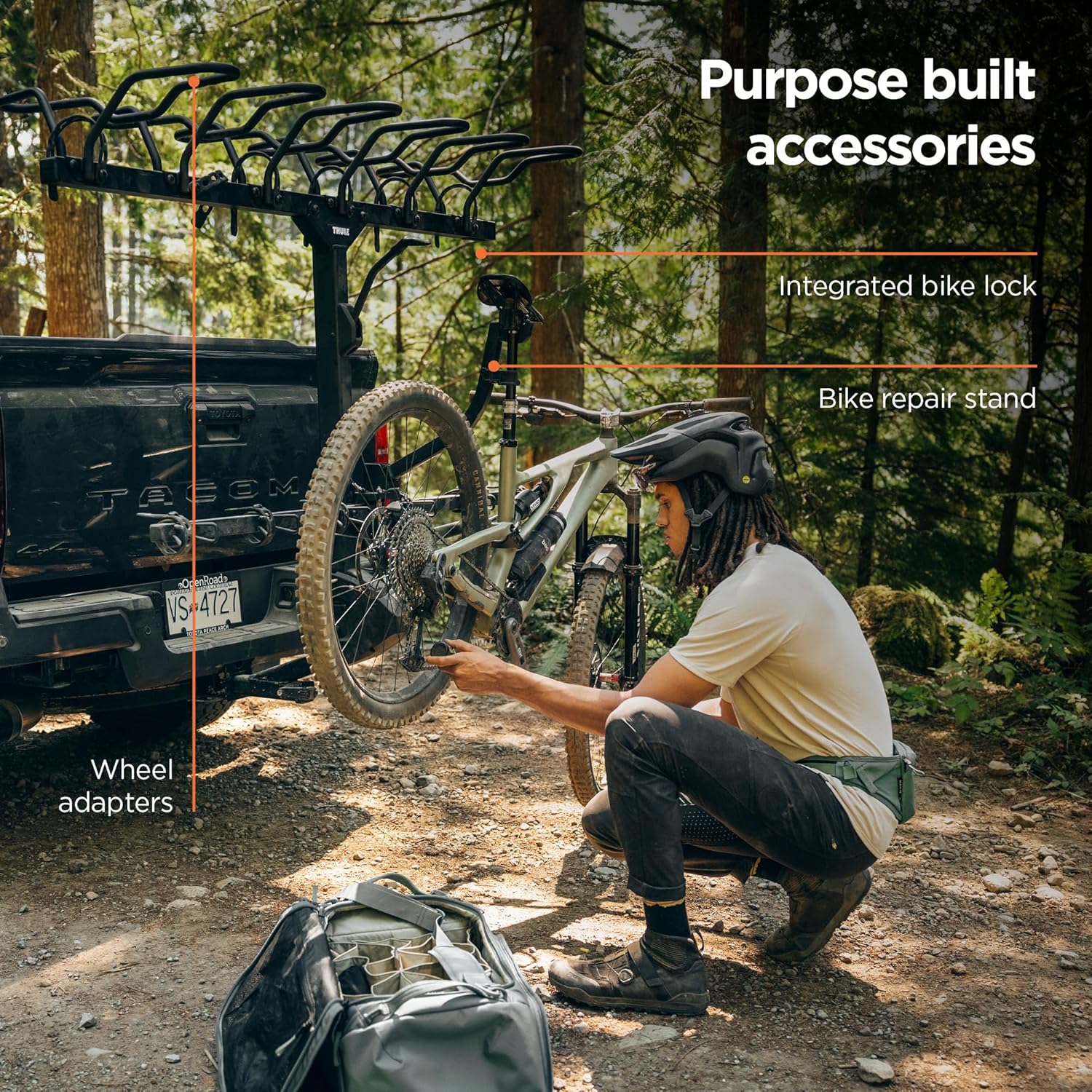 Rolling bikes into Thule ReVert wheel baskets – Cyclist effortlessly rolling a bike into the rack without lifting.