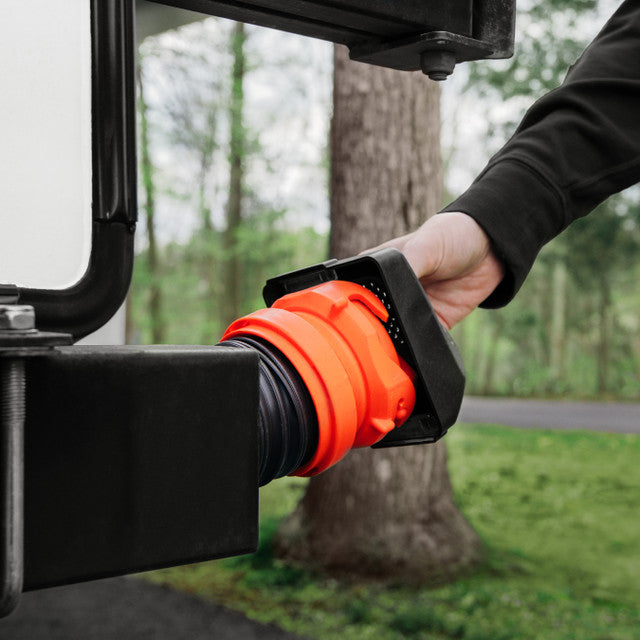 Rear view of Camco magnetic sewer hose cap showing secure fit for 4-inch RV bumper