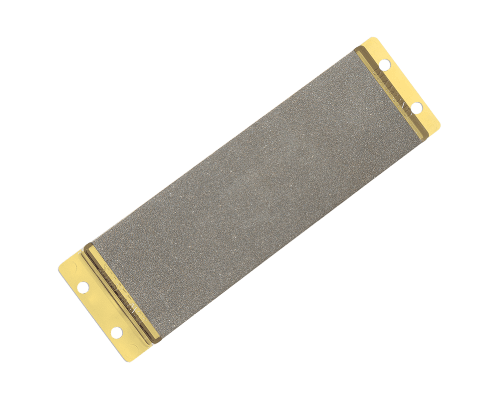 Rectangular sanding block with gold metal edges on a green background