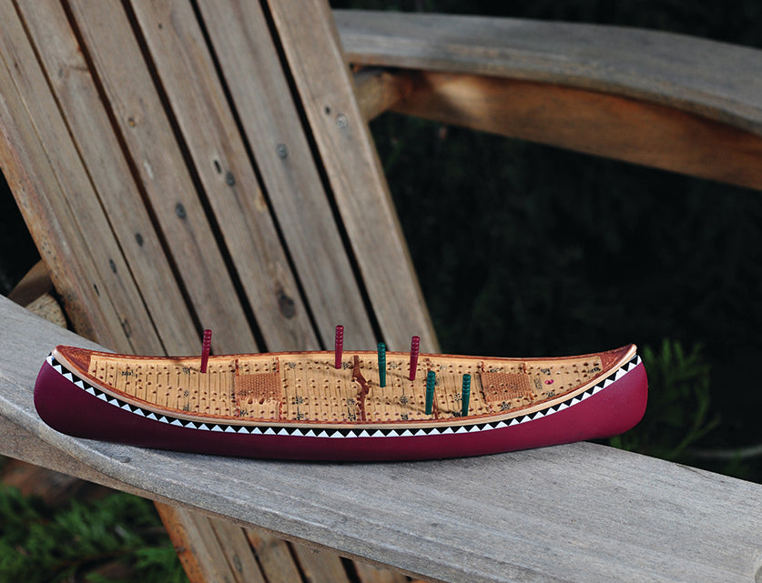 Canoe Cribbage Board showing hidden storage compartment for pegs