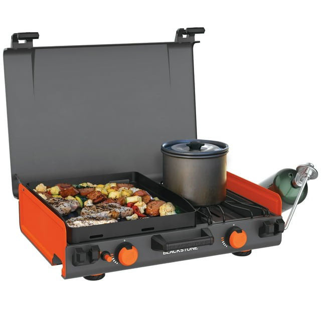 Rear view of the Blackstone camping griddle, highlighting the patented rear grease management system with a stow-and-go grease cup for convenient cleanup and portability.