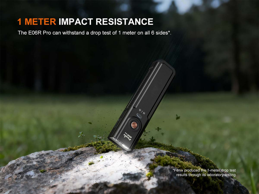 Black device on a rock with text about 1 meter impact resistance in an outdoor setting.