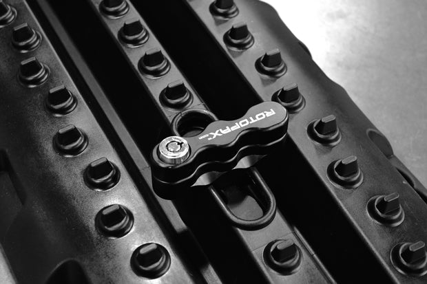 RototraX traction boards in black, designed for off-road recovery and overlanding vehicles.