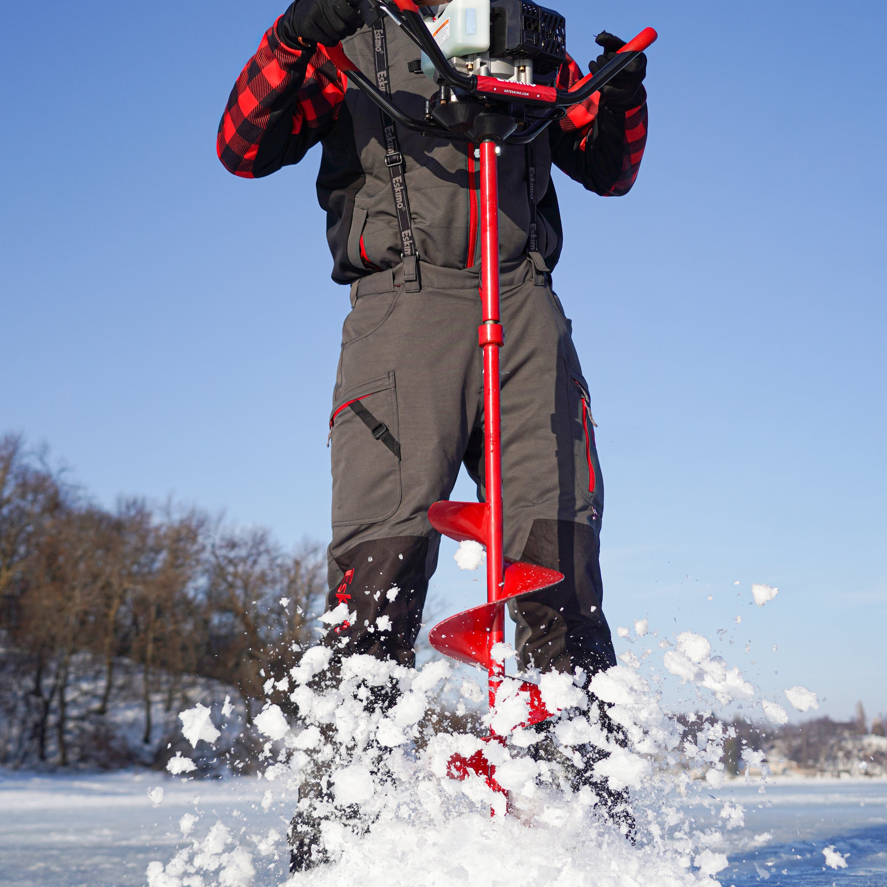 "Close-up of the Eskimo power auger extension's tubular steel build with red powder-coat finish, highlighting its durability."