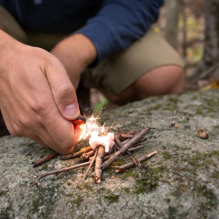 Compact one-handed fire starter for camping and hiking