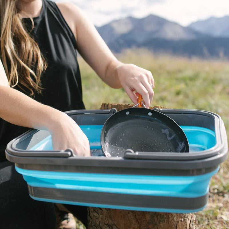 Close-up of collapsible handles on the Flat Pack Sink, turning it into a basket for easy carrying