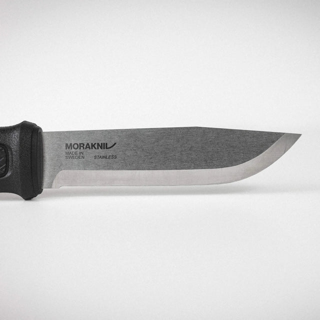 Knife with a black handle on a white background