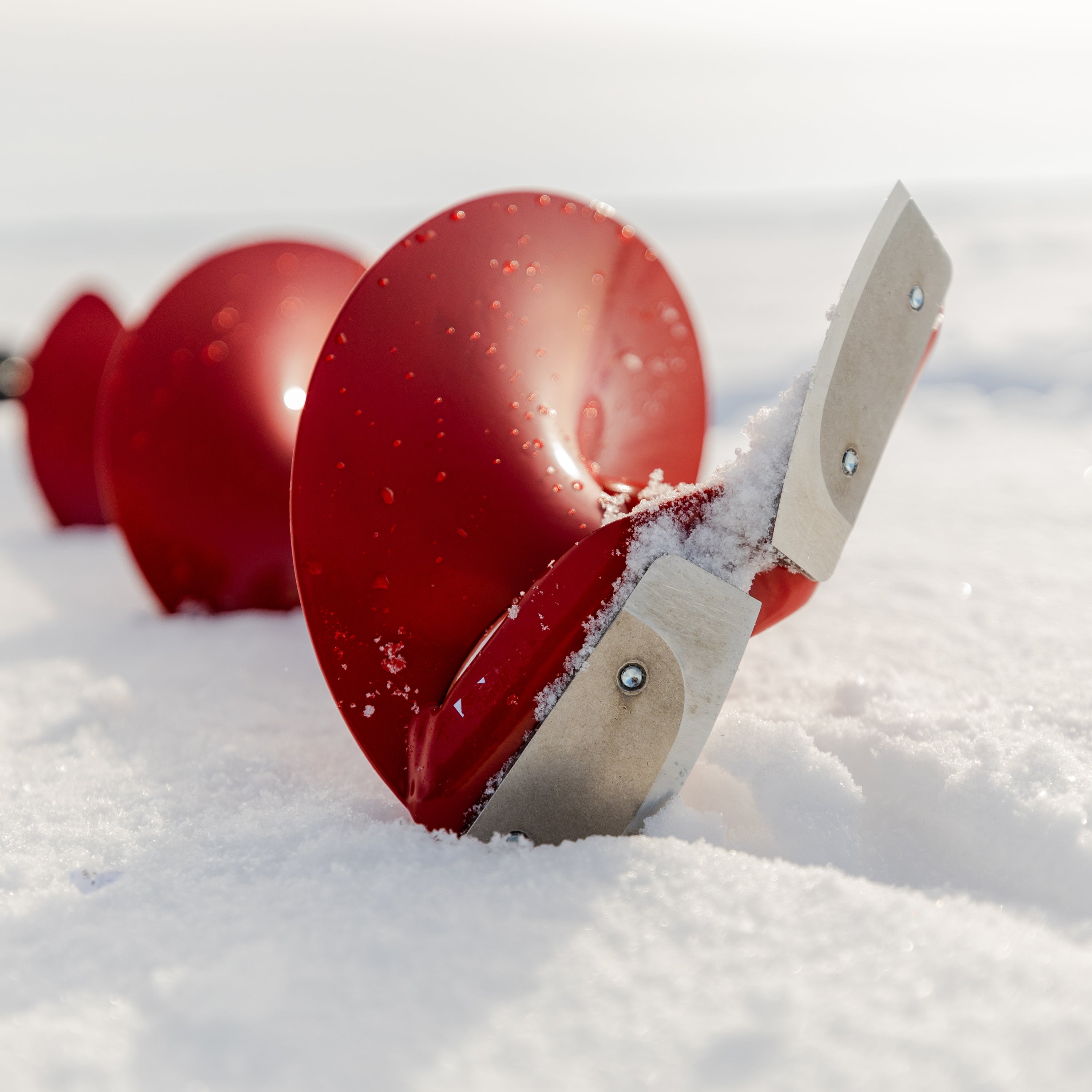 Ice fishing auger with Cross-Bolt Takedown System for easy drilling.