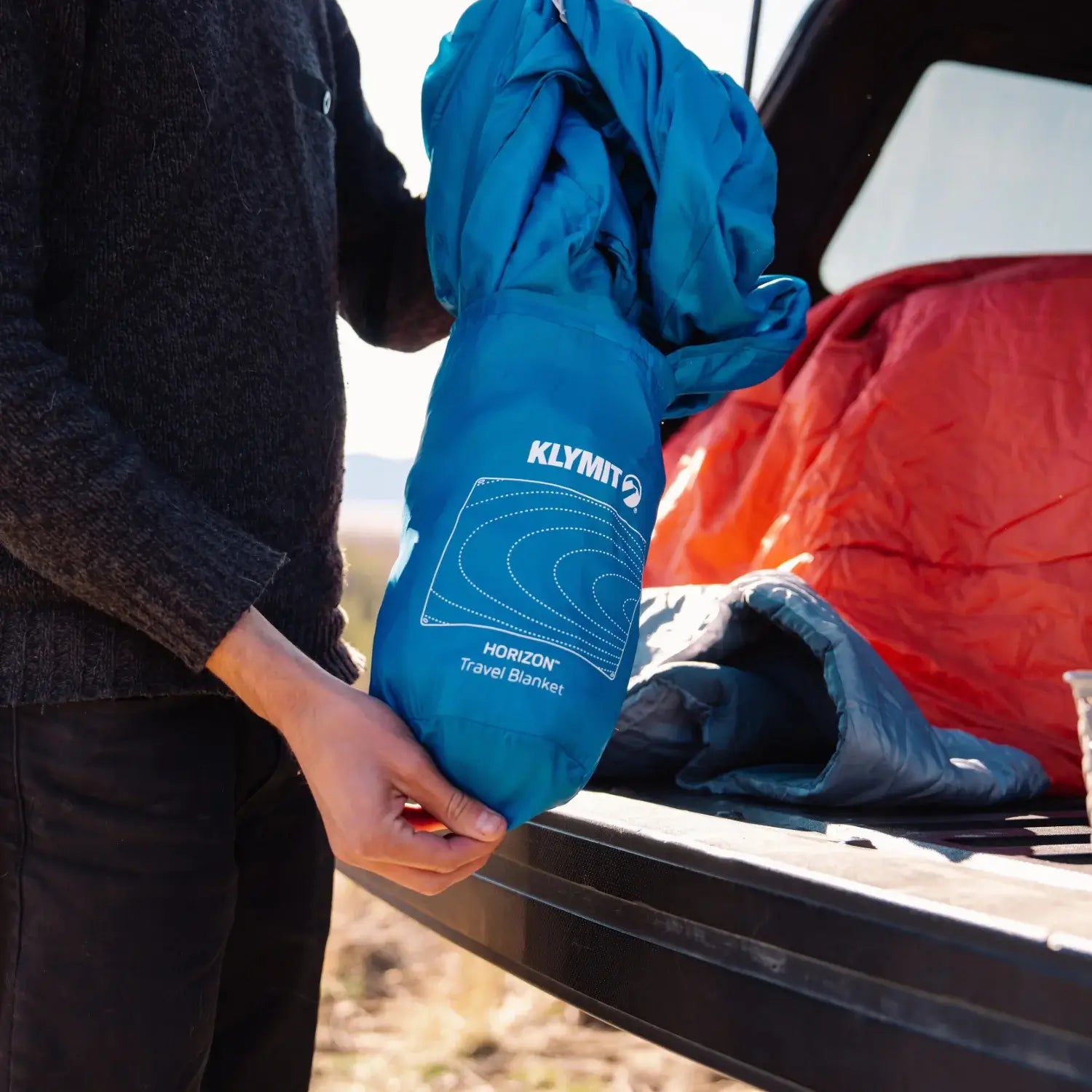 Compact packed Horizon blanket ready for hiking and camping travel