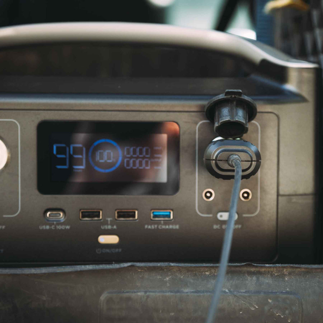 The Ignik 12V battery adapter connected to a power source, demonstrating its functionality for delivering maximum heat output