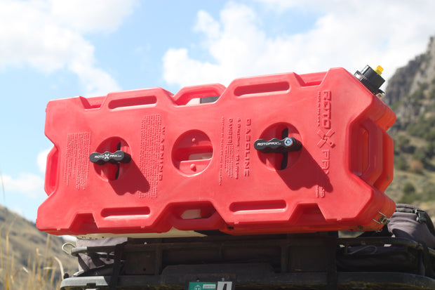 4 Gallon rotopax mounted with standard mounts on a jeep