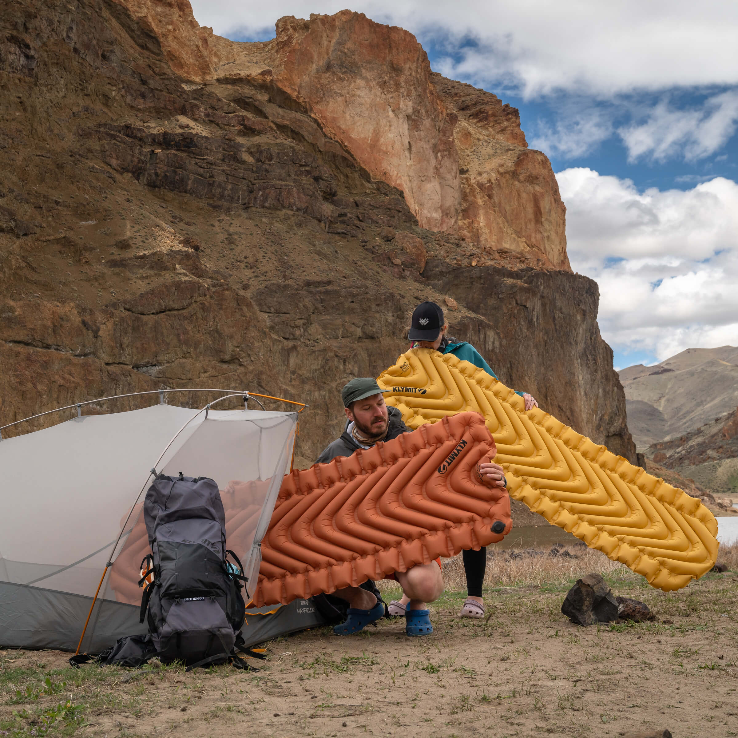 Packed Insulated Static V Lite Eco sleeping pad next to included stuff sack and patch kit