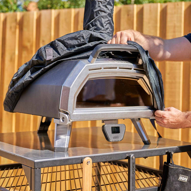 Custom-fit oven cover with elastic edge and adjustable strap for Ooni Karu 16