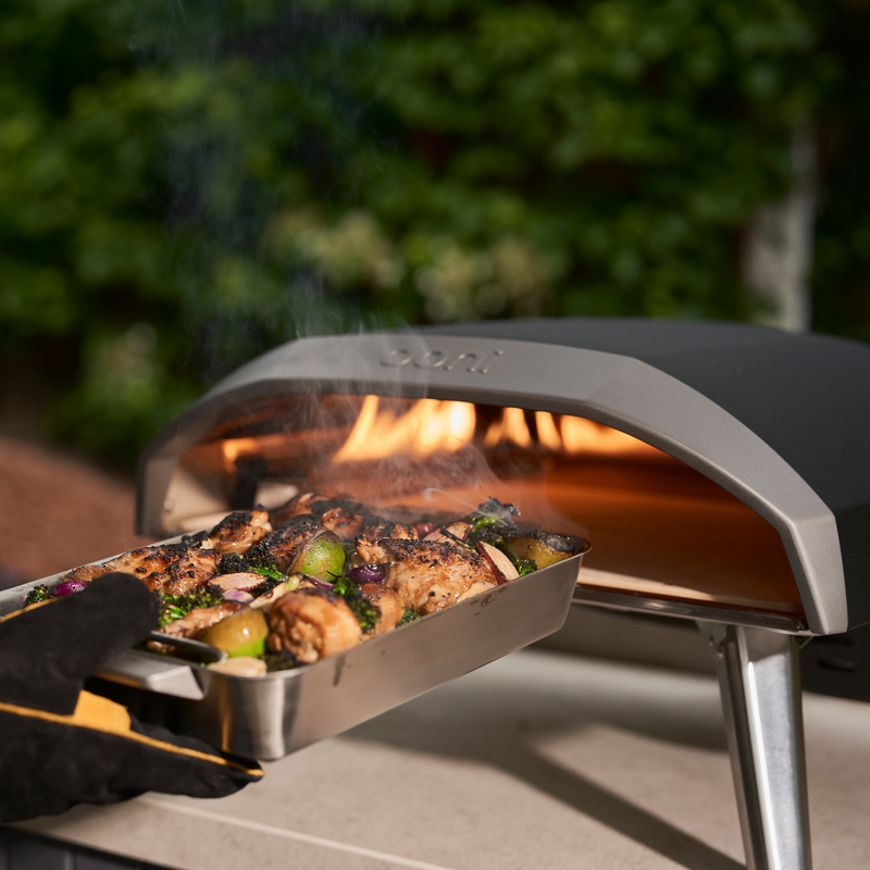 Innovative L-shaped burner for even heat distribution in outdoor pizza oven