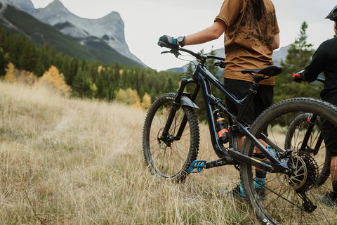 Kodiak Singletrack Holster zip-tied to bike frame for secure and accessible bear spray carry