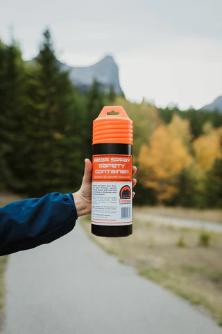 Hard PVC bear spray storage container with absorbent foam lining for safe transportation.