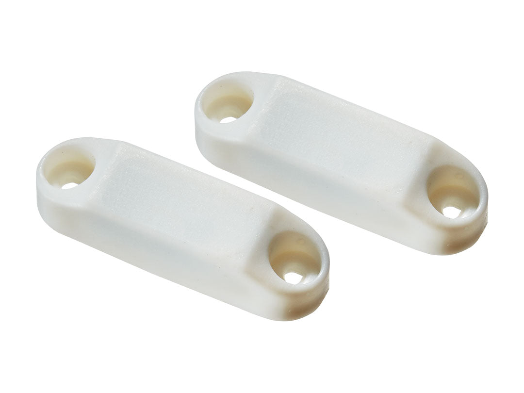 Two white plastic connectors on a white background
