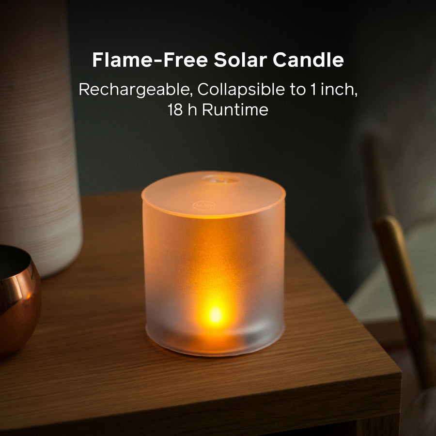 Flame-free solar candle on a table with text about its features.