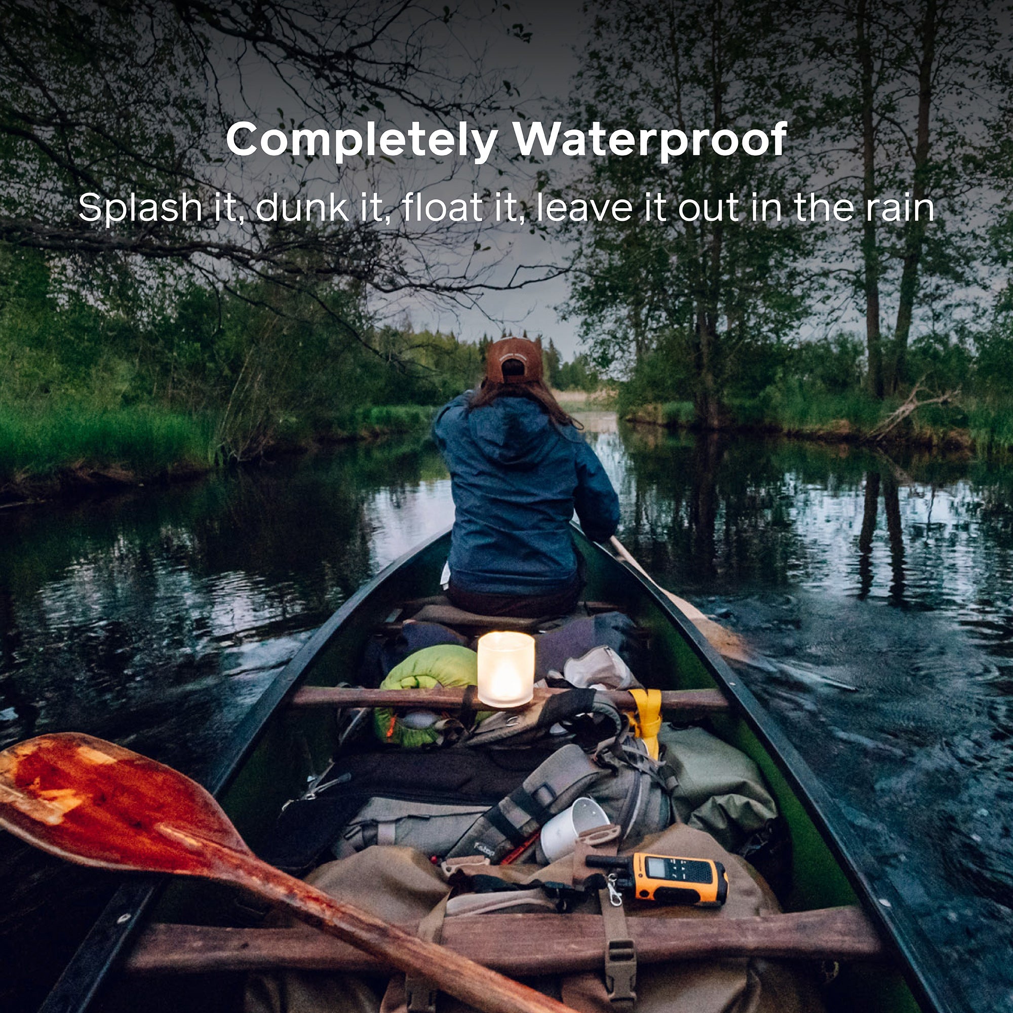 Person in a canoe on a lake with waterproof text overlay