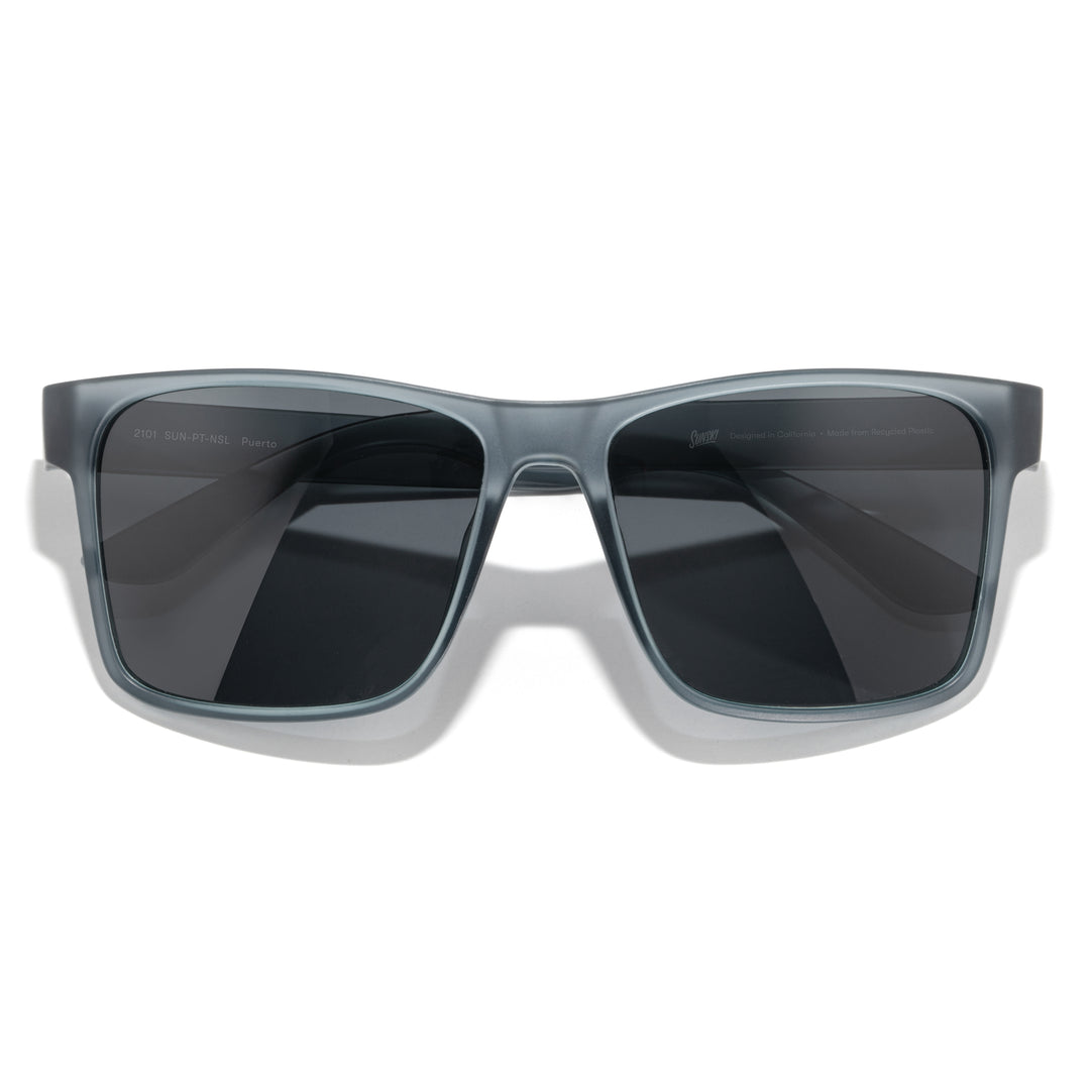 Surf-style sunglasses with bold browline and polarized TAC lenses