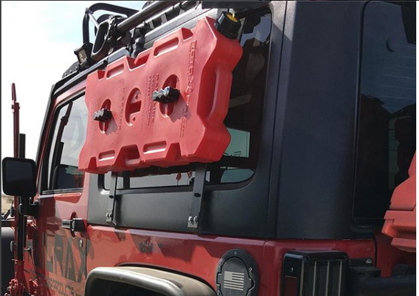 4 Gallon gasoline rotopax tank mounted on the side of a jeep