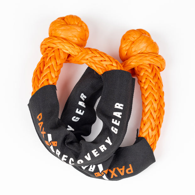 Premium vehicle recovery gear with tree saver strap and soft shackles