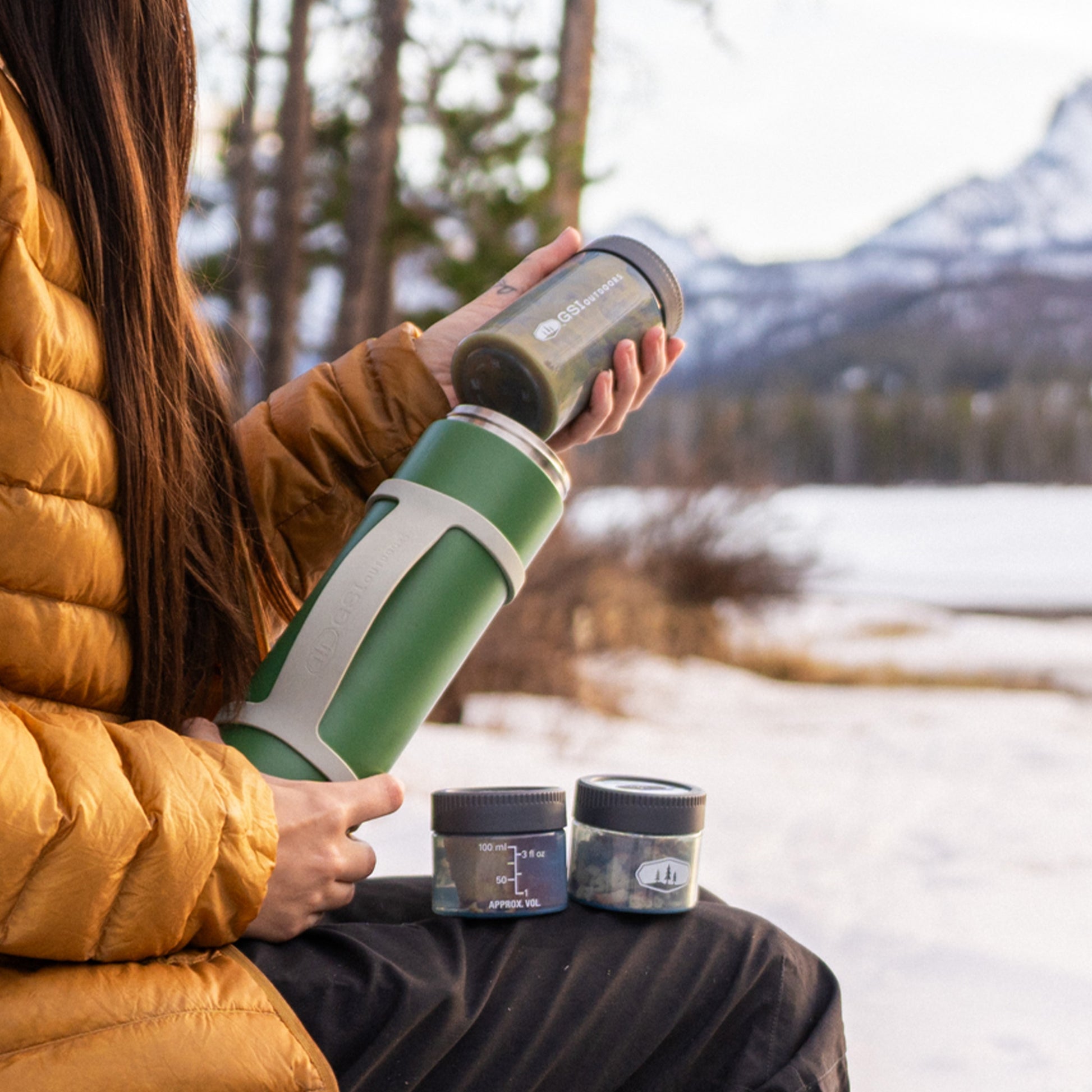 Vacuum insulated food container with removable stackable storage compartments.