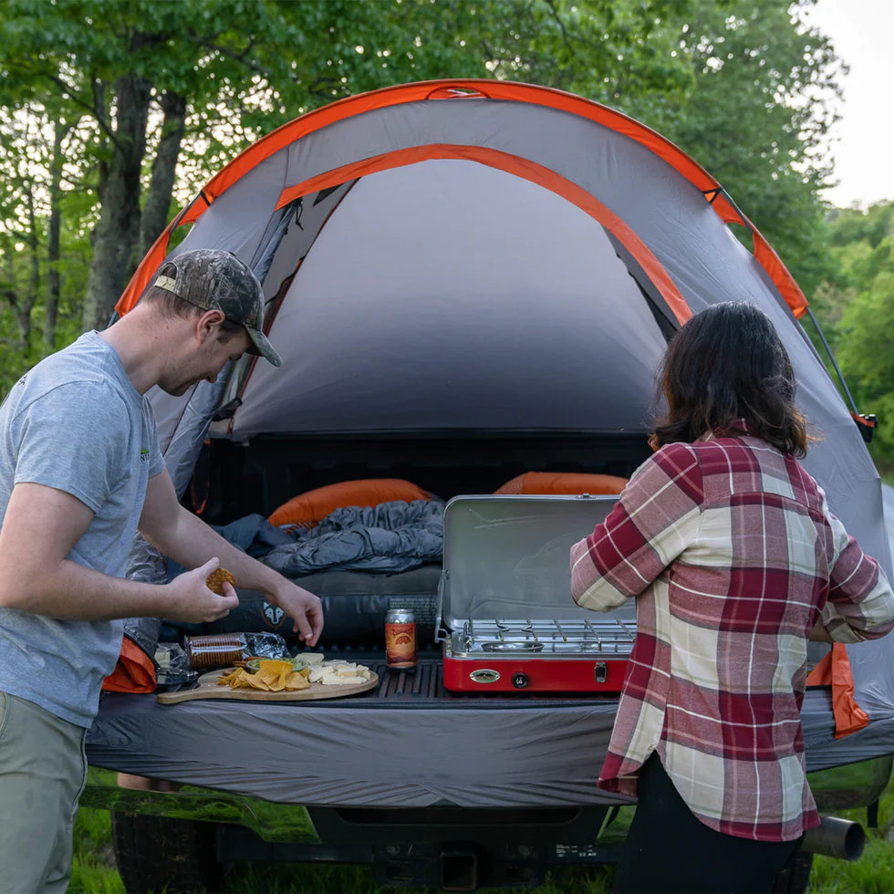 Truck Tent packed in a compact stuff sack with a sewn-in setup guide.