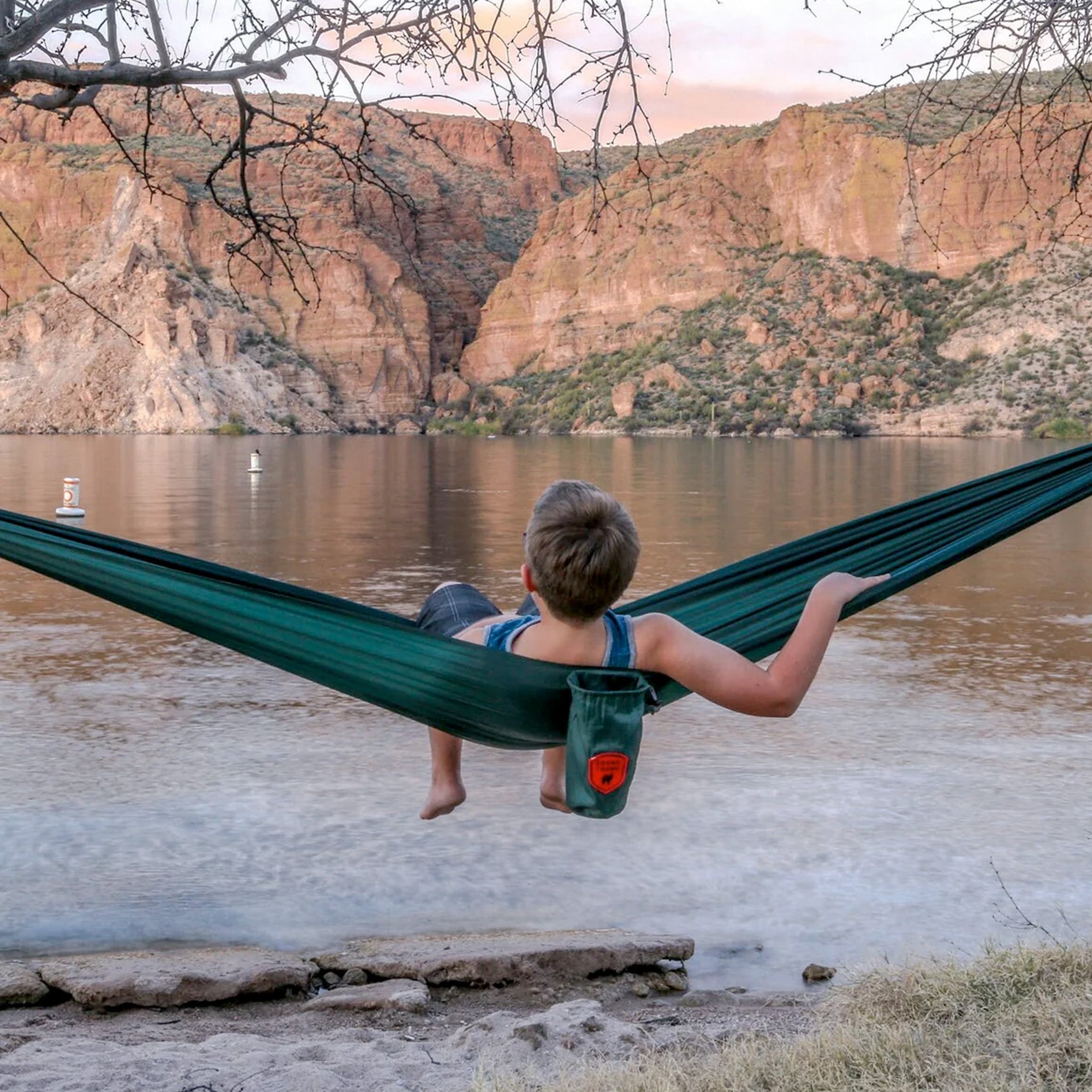 Durable ripstop polyester hammock with included carabiners; suspension straps sold separately