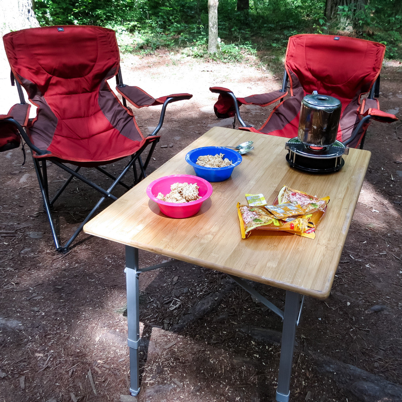 Portable RV camping table with bamboo top and leveling feet