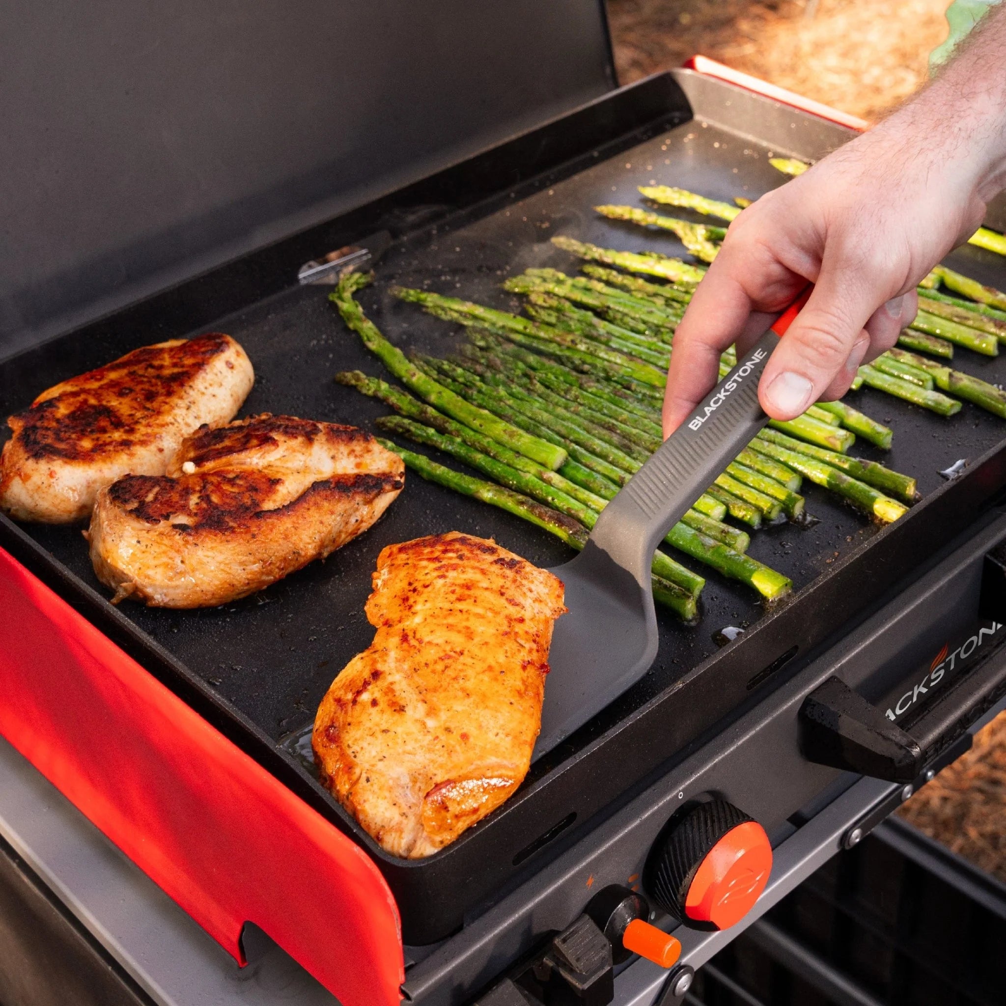 Outdoor cooking tools from Blackstone including spatulas scraper and squeeze bottles